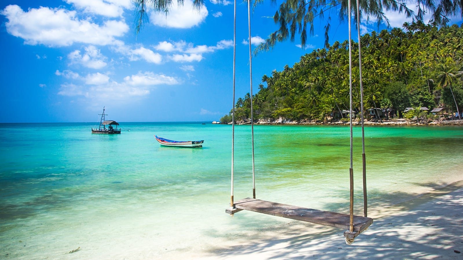 Beautiful beach swing over turquoise water in Koh Samui