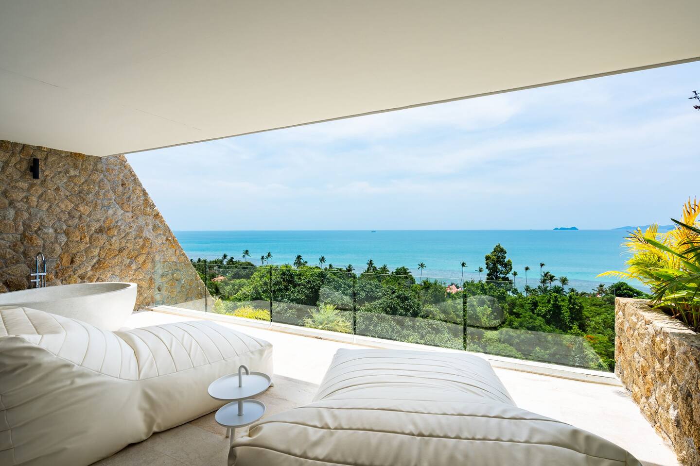 Mansion terrace with ocean view and lounge seating